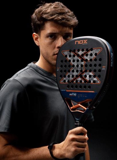 NOX AT10 padel racket held by a player